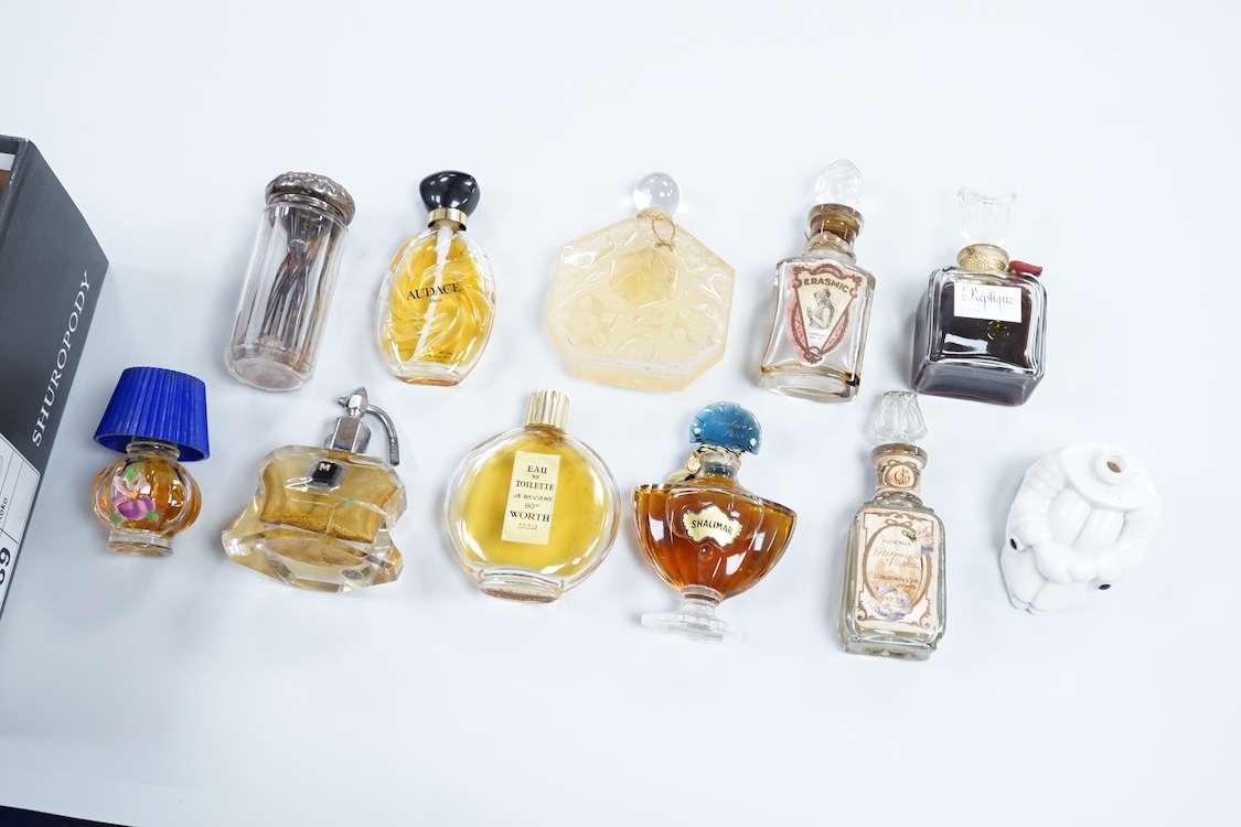 A Baccarat Guerlain perfume bottle in original box and a collection of other empty perfume bottles